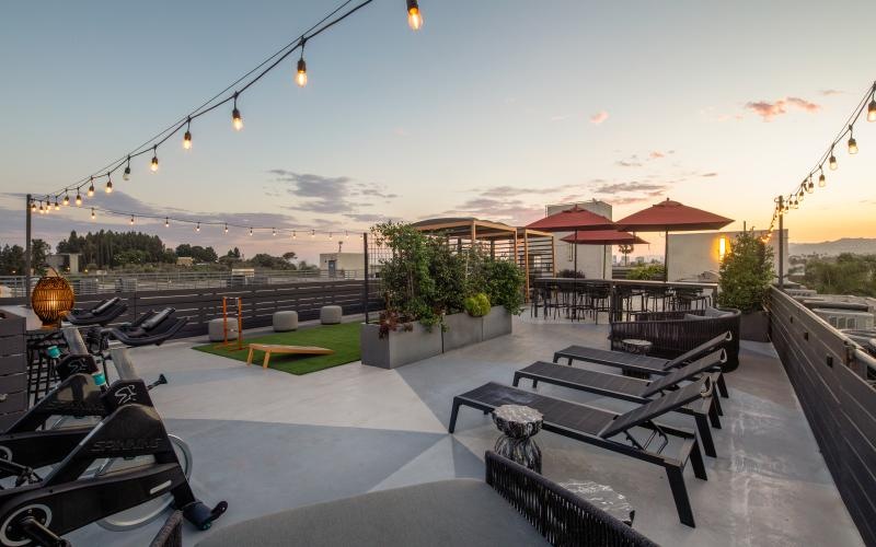 a patio with tables and chairs